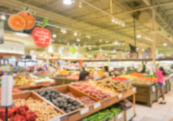 Abstract Blurred Busy Customer Shopping For Fresh Vegetables In