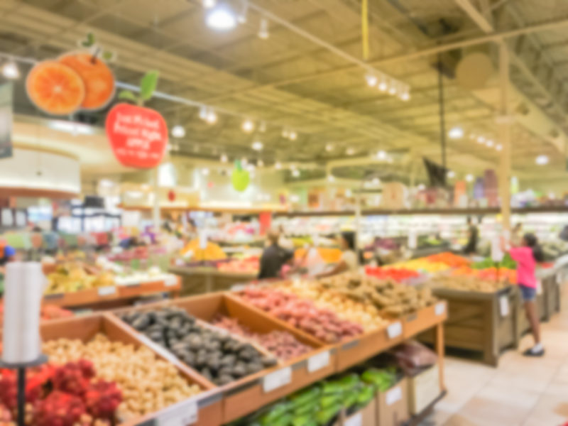 Abstract Blurred Busy Customer Shopping For Fresh Vegetables In