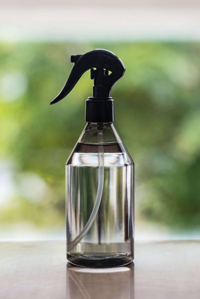 black spray bottle with water inside